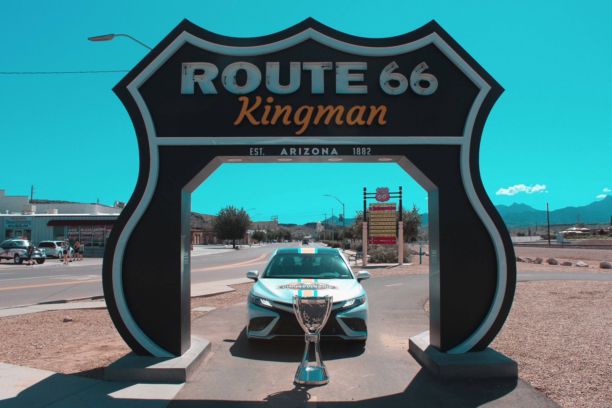 Bill France Cup & the Toyota Camry Phoenix Raceway Pace Car in front of the Route 66 Kingman sign